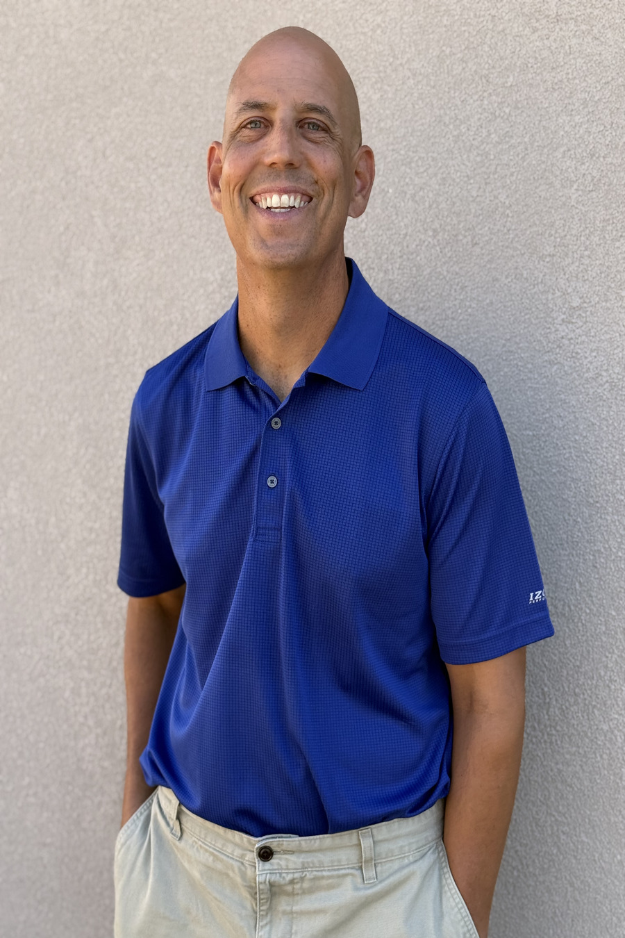Jeff Button smiling in a blue shirt