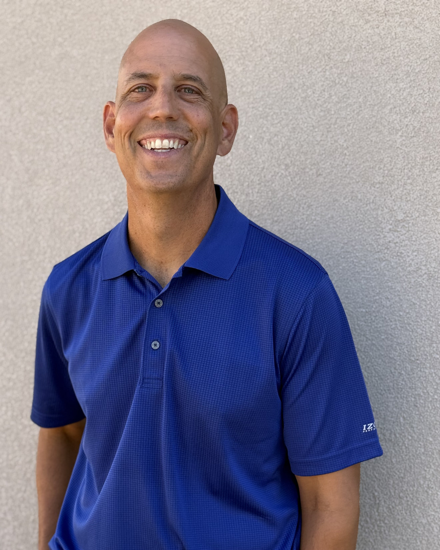 Jeff Button smiling in a blue shirt